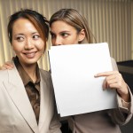 Businessman Looking Suspiciously Over His Shoulder