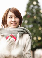Young Woman Enjoying Christmas Lights