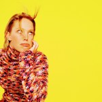 Woman Sitting with a Bored Expression